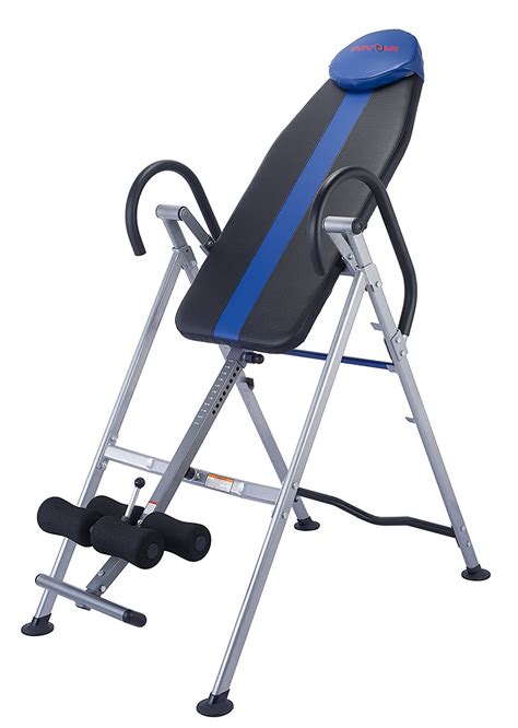 Raise your feet onto the steps one at a time. . Inversion table elite fitness